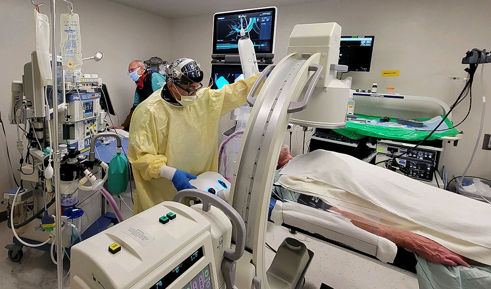 A physician using the Ion robot on a patient